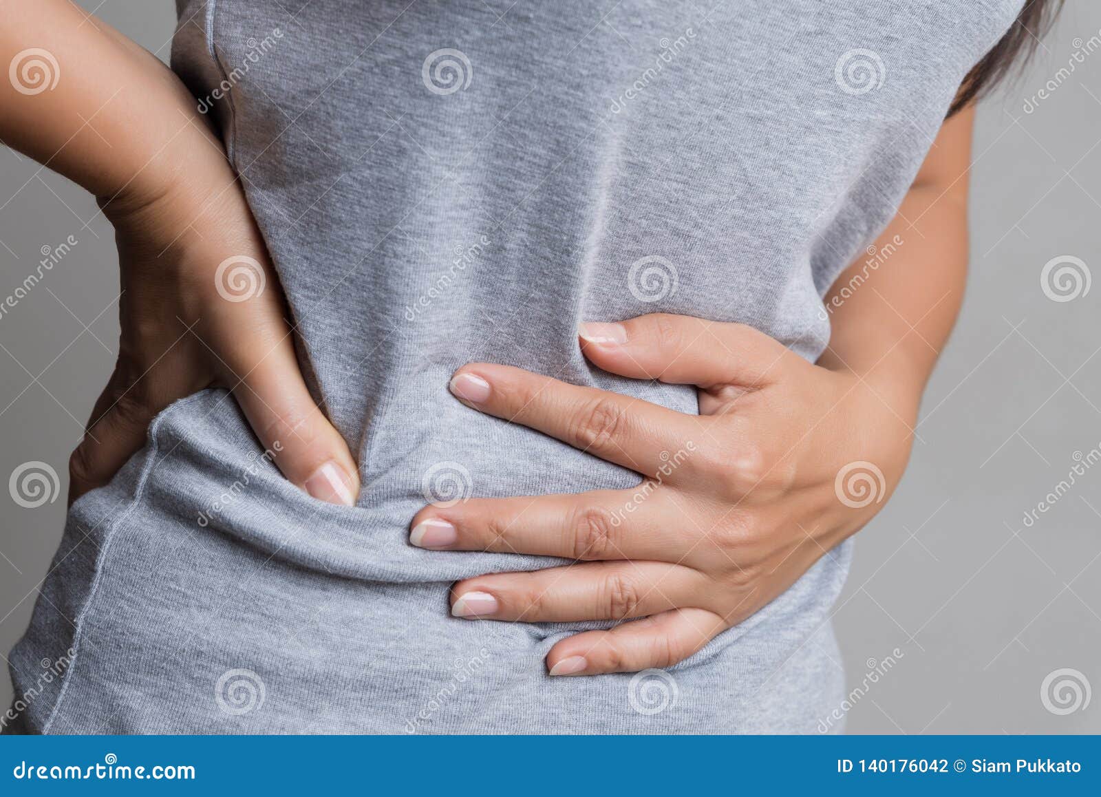 young woman having painful stomachache. chronic gastritis. abdomen bloating and healthcare concept