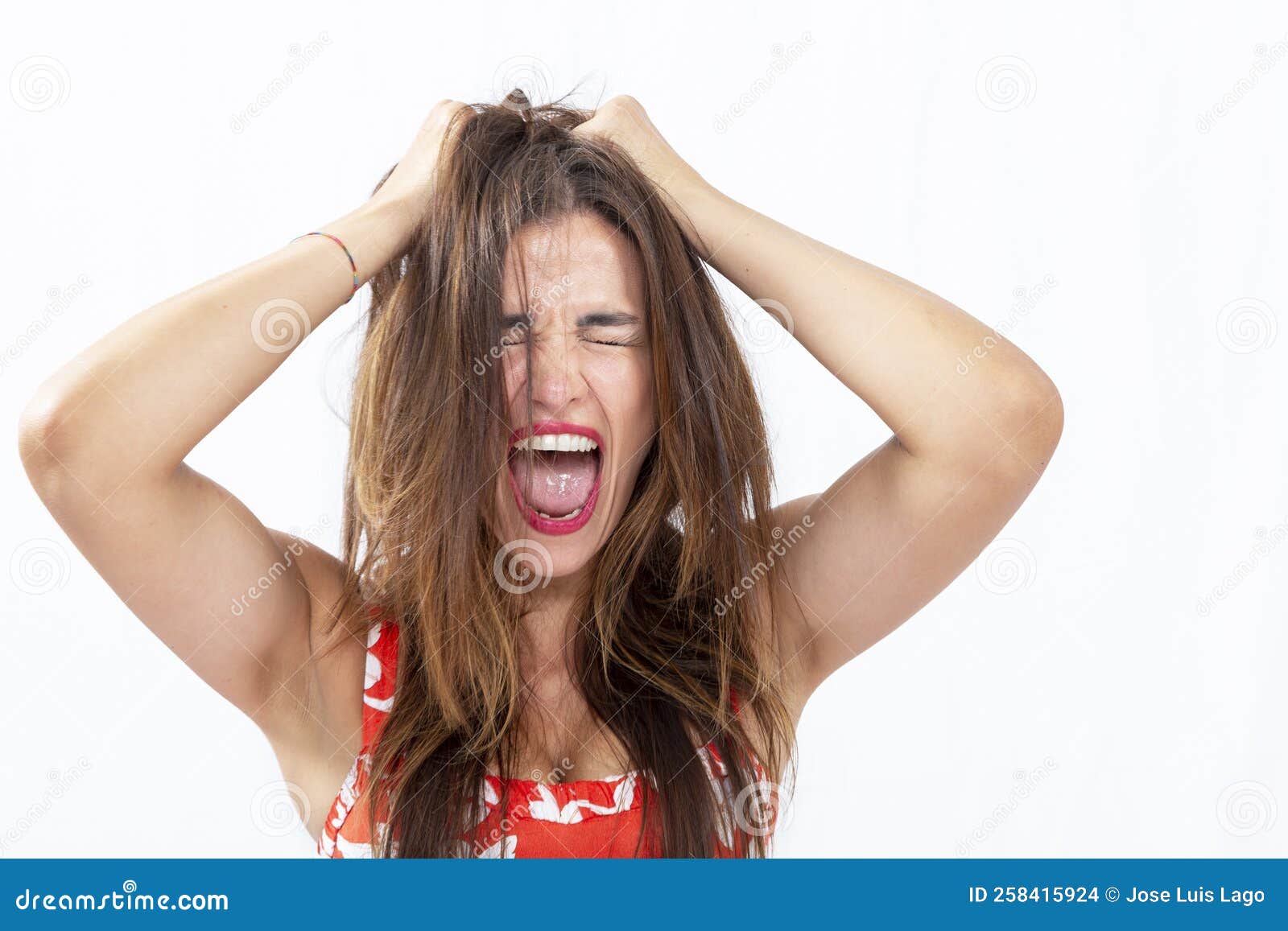 Hysterical Woman Expression with Her Hands on the Head Stock Photo