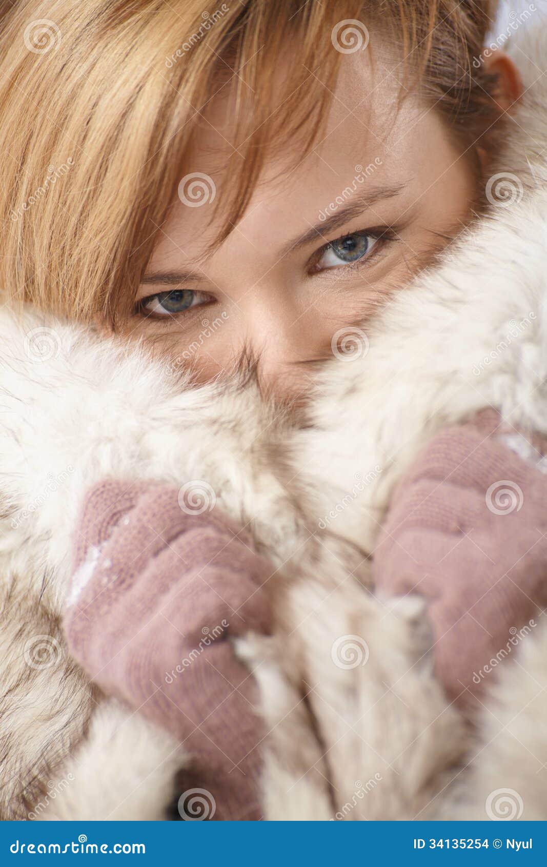 Young Woman Hiding Her Face In Fur Coat Stock Images - Image: 34135254