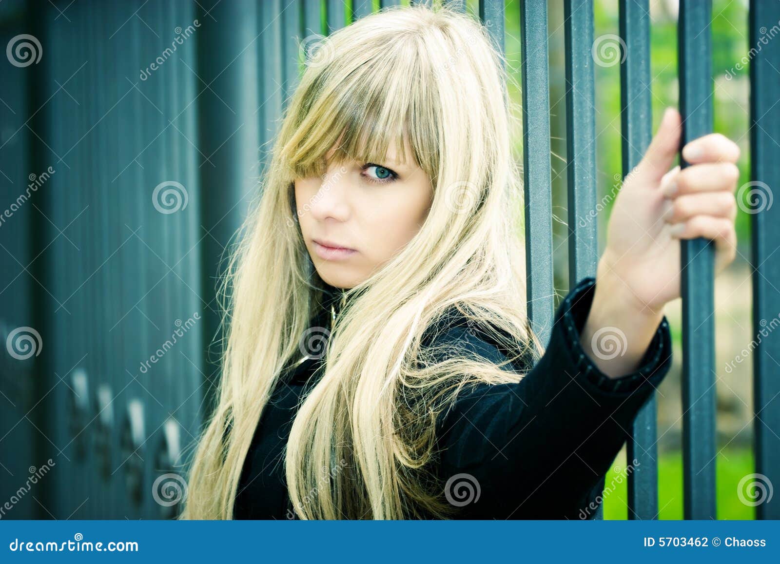 Young Woman Holding on Fence Stock Photo Image of hand, severe 5703462