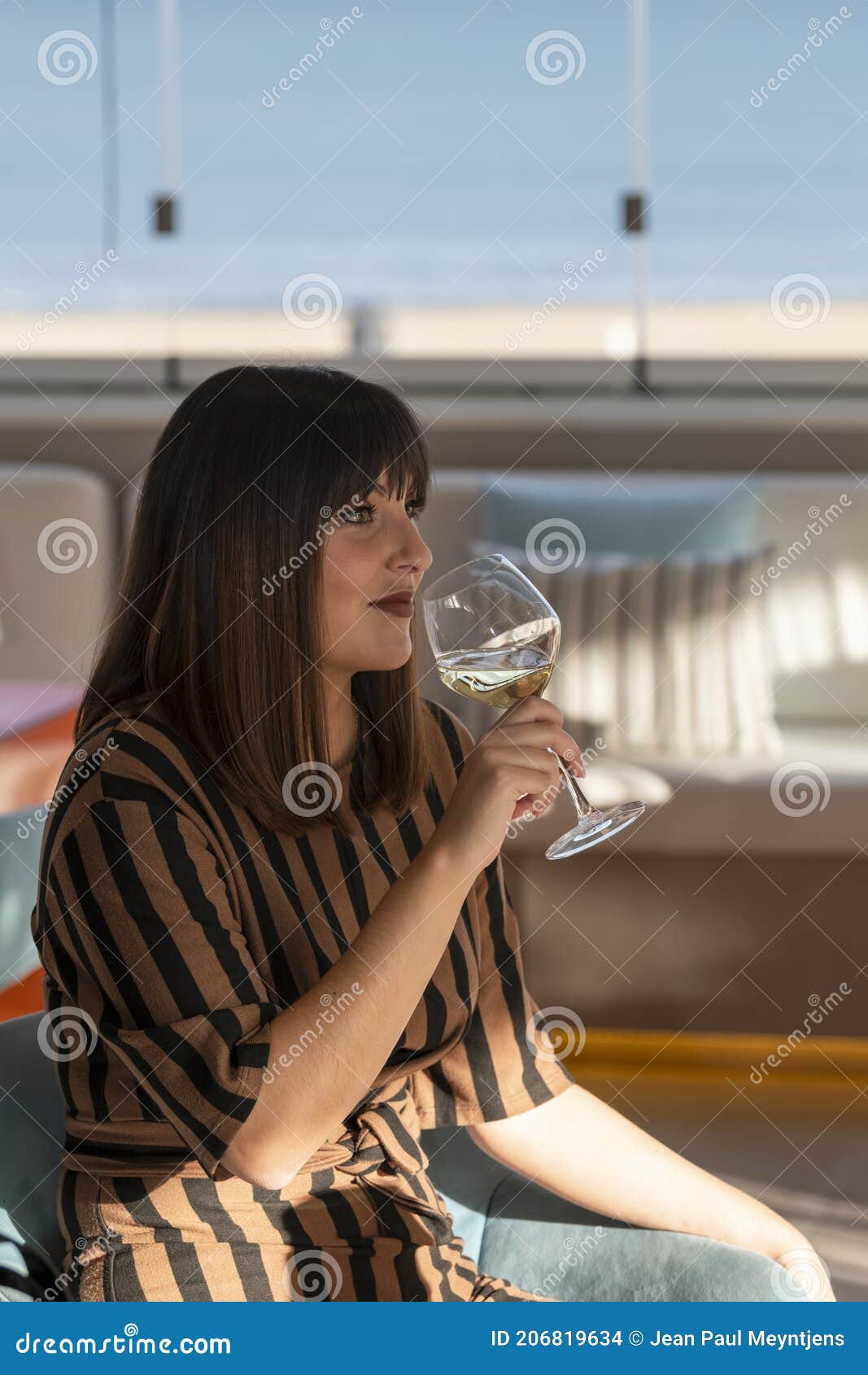 Young Woman Holding a Glass of Wine at a Bar Terrace Stock Photo ...