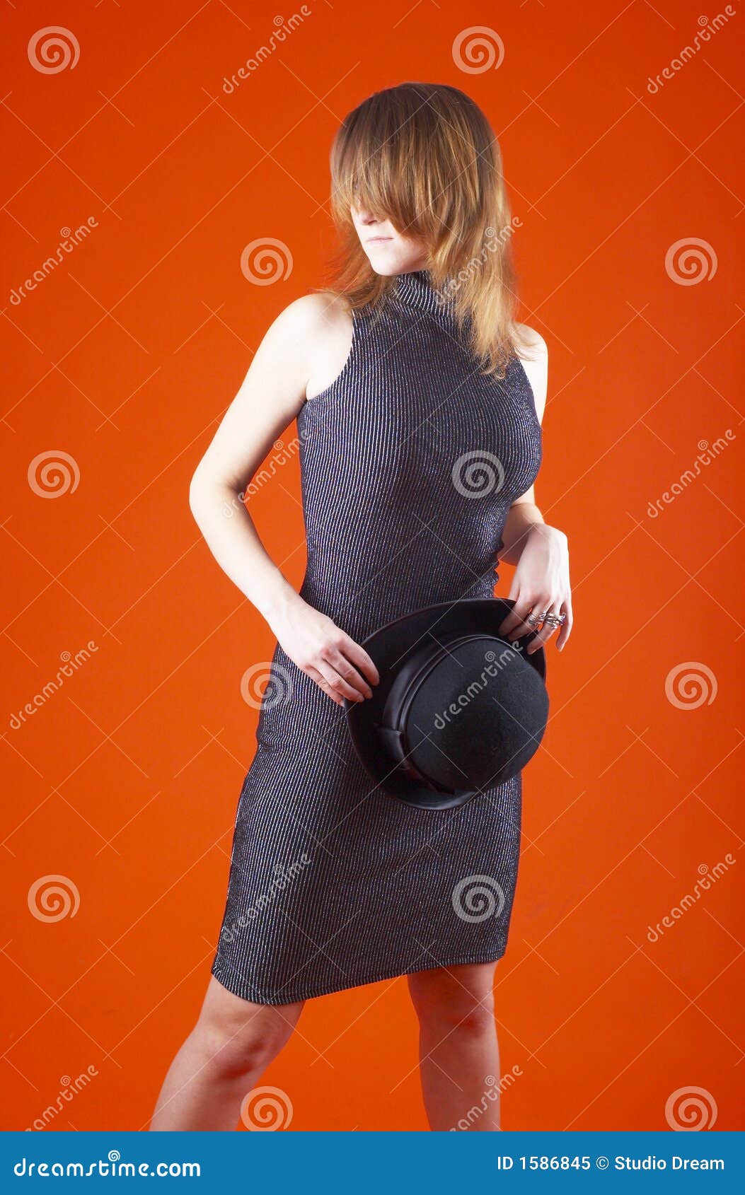 Young Woman Holding Hat stock image. Image of fashionable 1586845