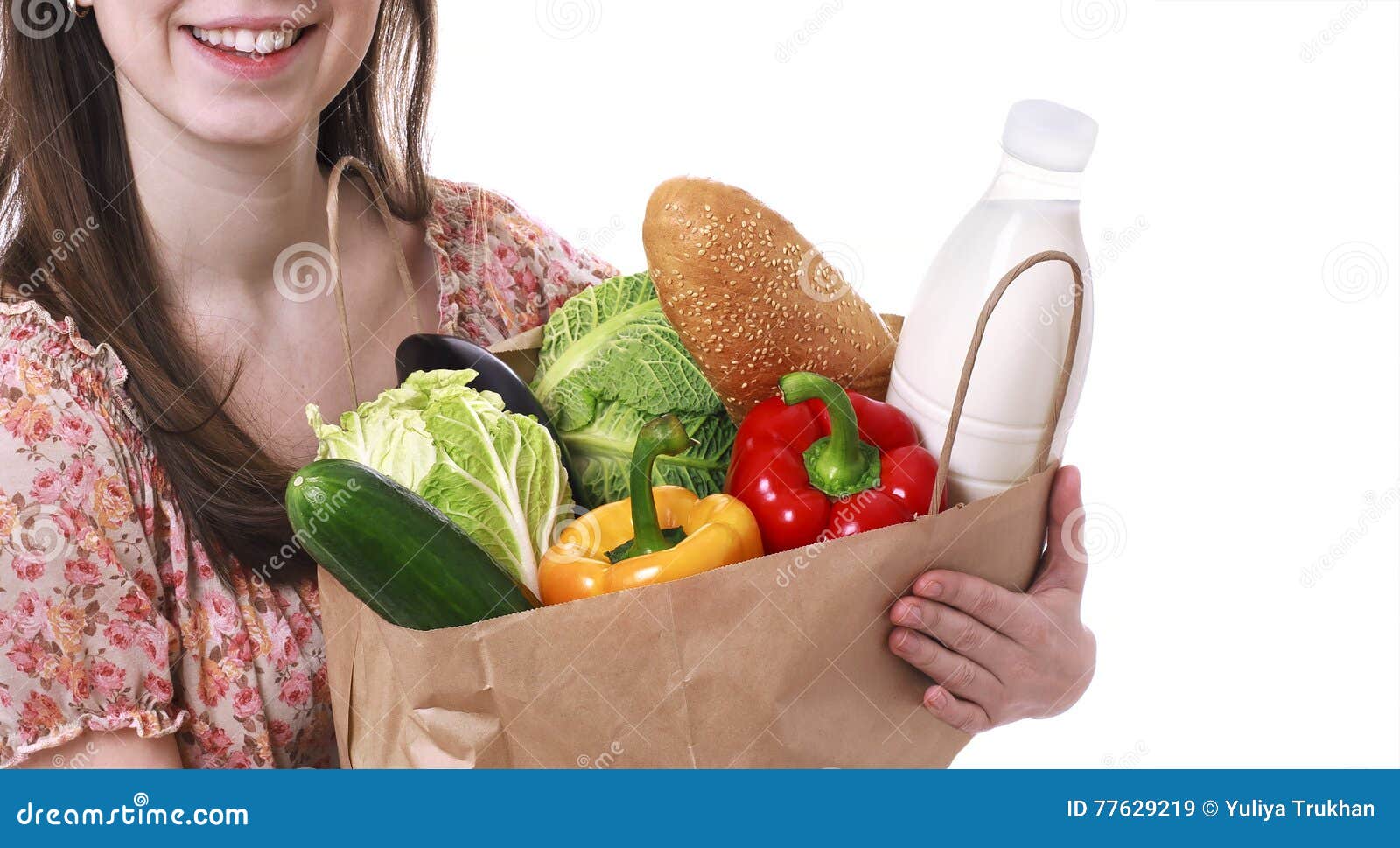 young woman holding large bag of healthly groceries stock image