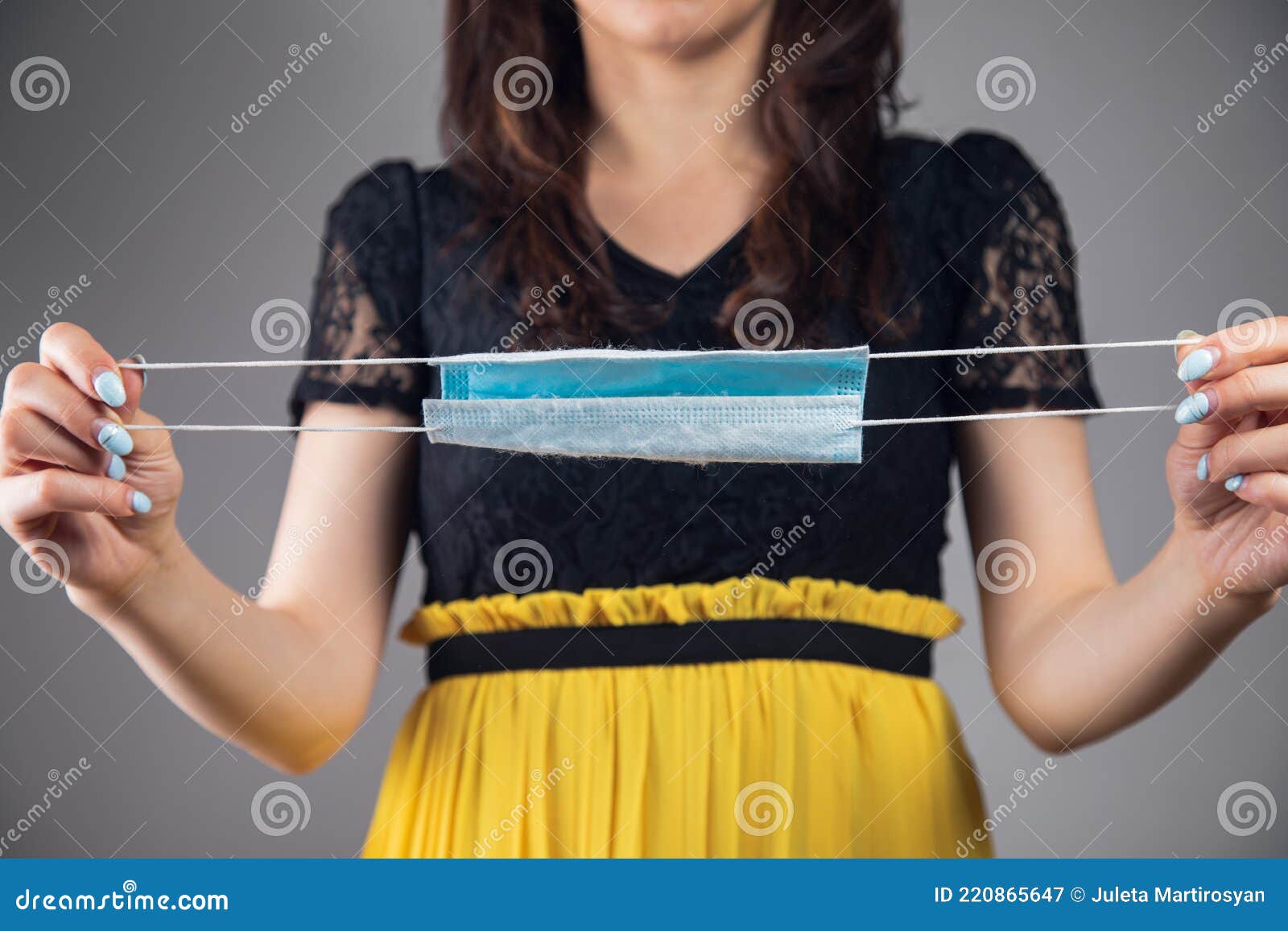 Young Woman Holding a Mask in Her Hands Stock Image Image of