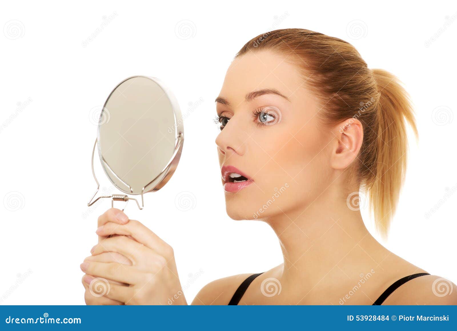Young Woman Holding a Mirror. Stock Photo Image of hygiene