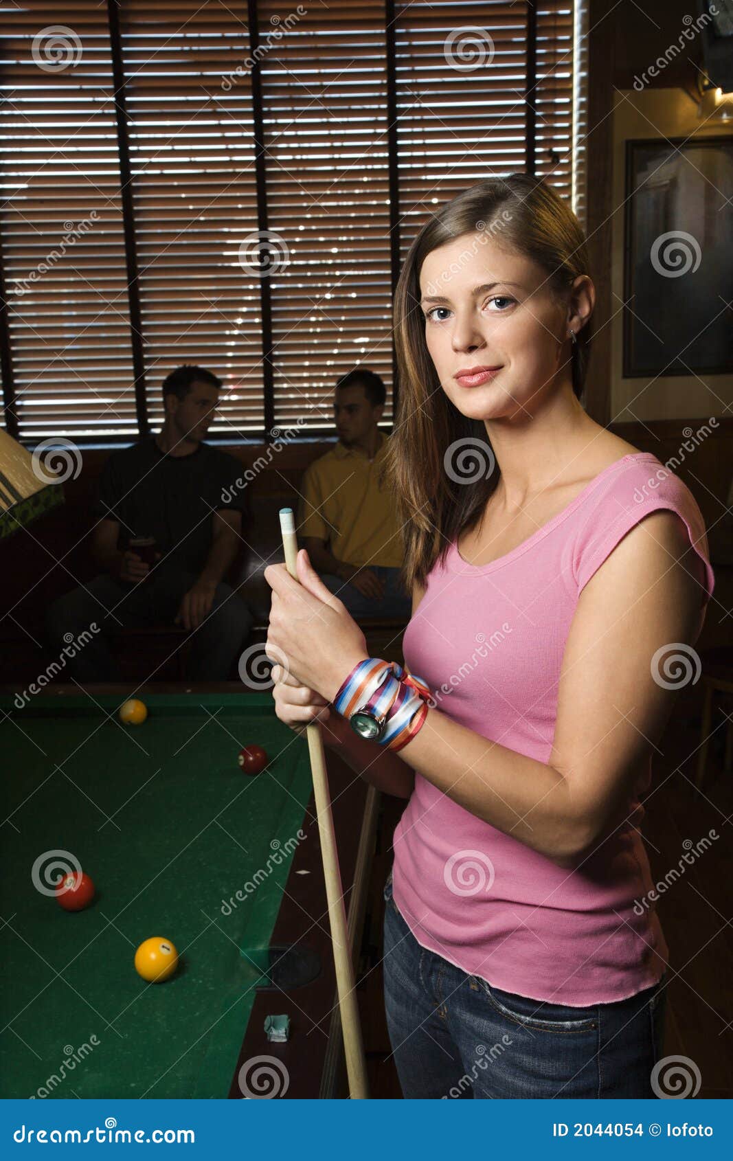 Young Woman Holding Pool Stick. Stock Photo - Image of 