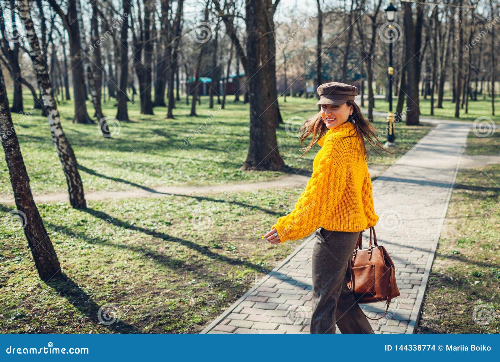 Young Woman Holding Stylish Handbag and Wearing Yellow Sweater. Spring ...