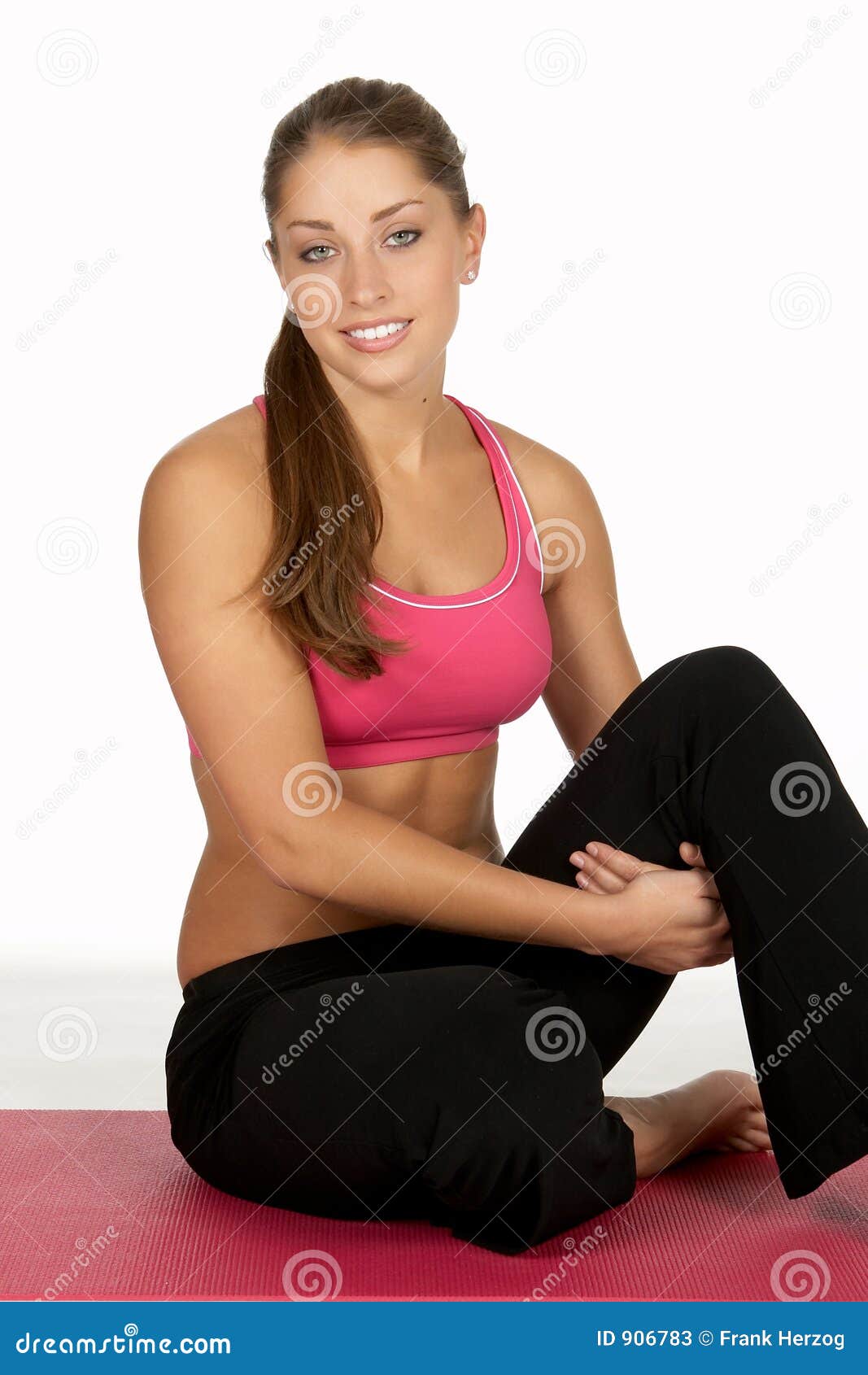 Two women in fitness wear hugging each other standing on rooftop