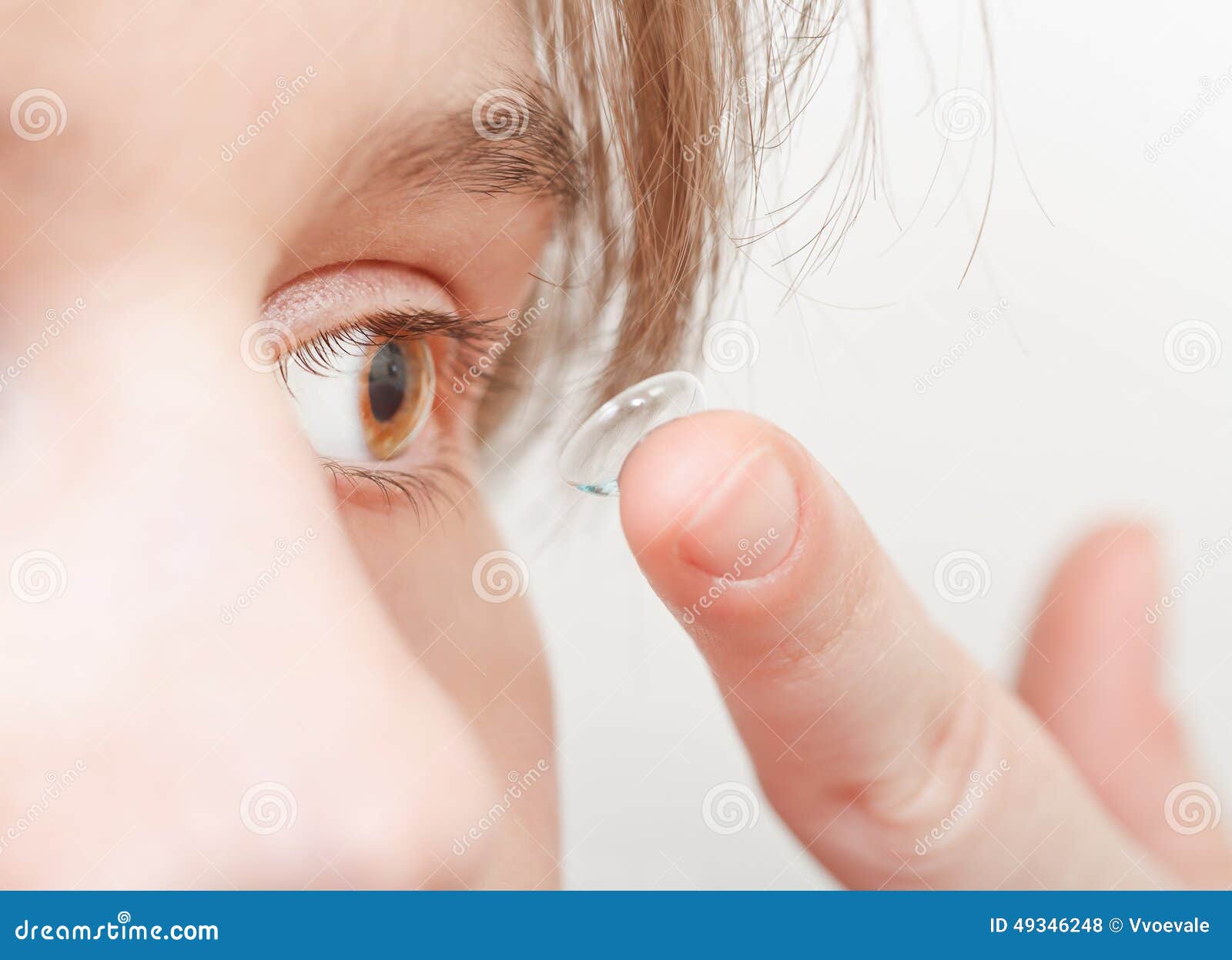 Young Woman Inserts Corrective Lens in Eye Stock Photo Image of