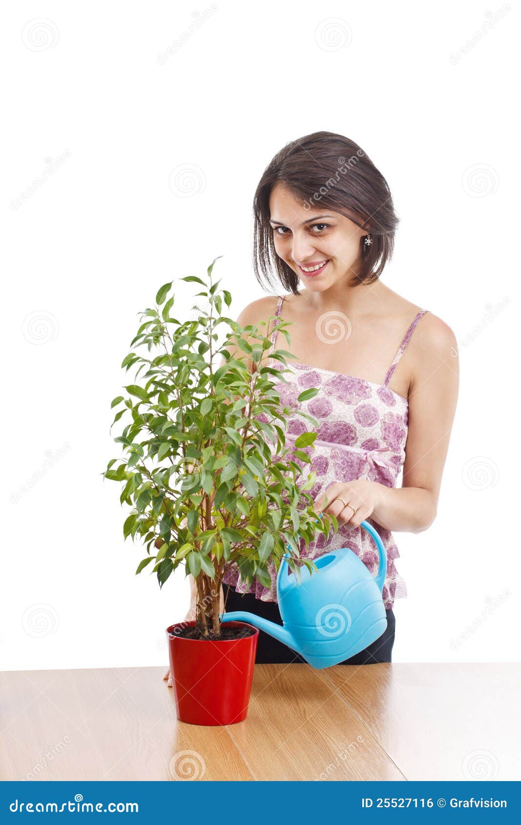 young woman irrigate plants