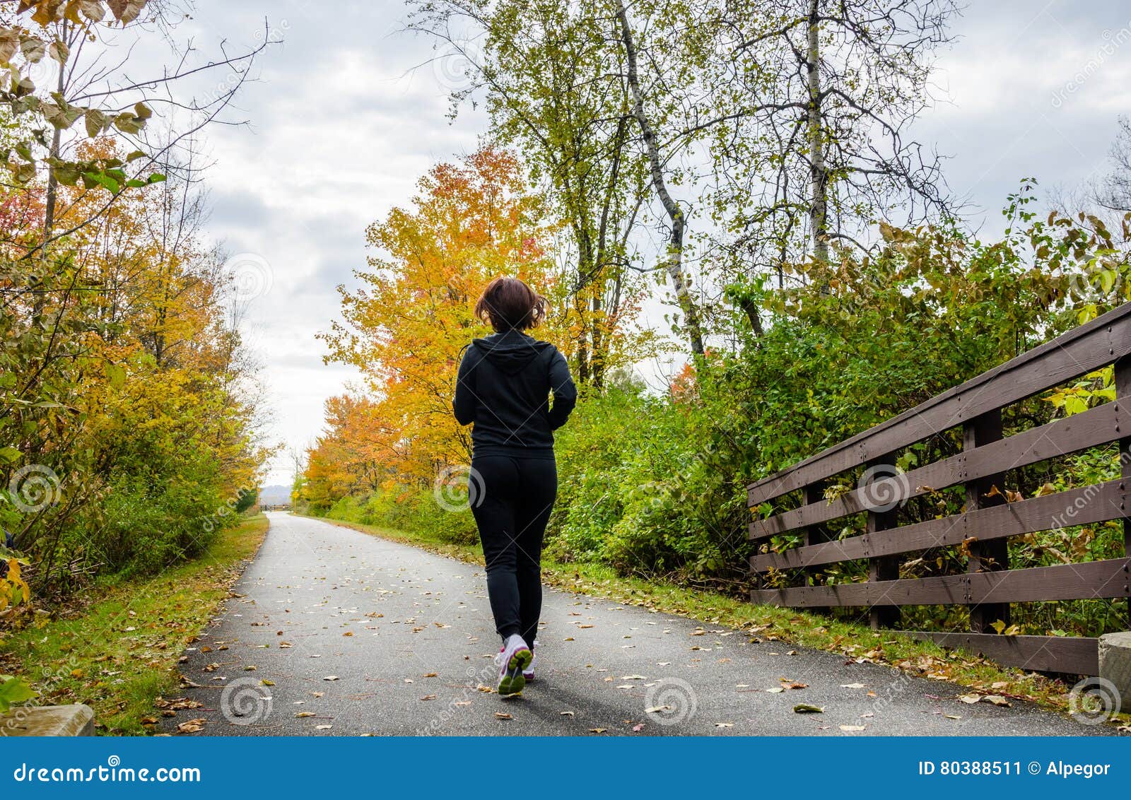 Young Woman Jogging and Cloudy Sky Stock Image - Image of leisure ...