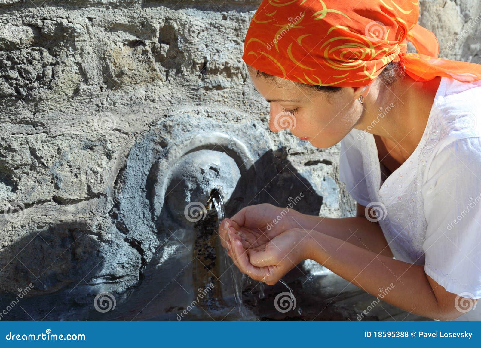 young woman in kerchief drinking water
