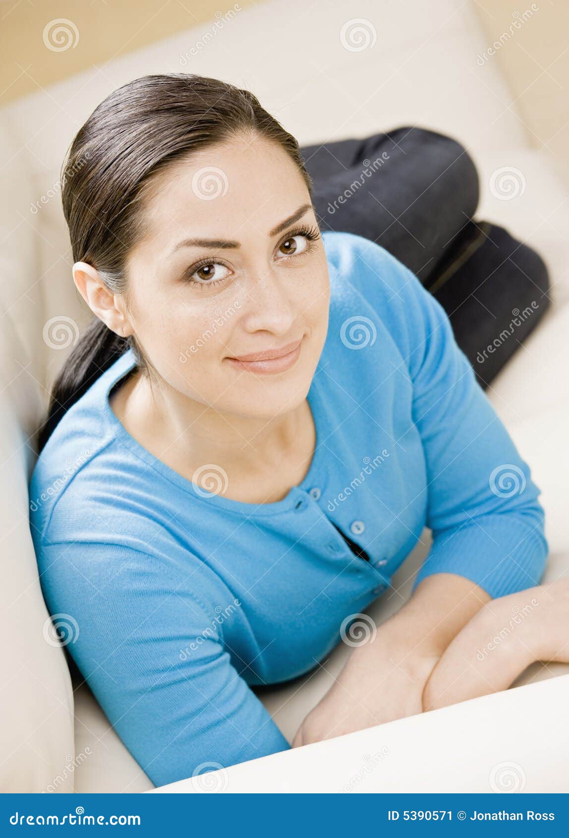 Portrait of a Young woman laying on sofa