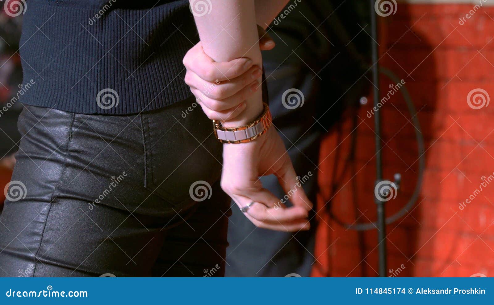 A Young Woman Holding Her Hands Behind Her Back And Wiggles Her Fingers Stock Footage Video Of