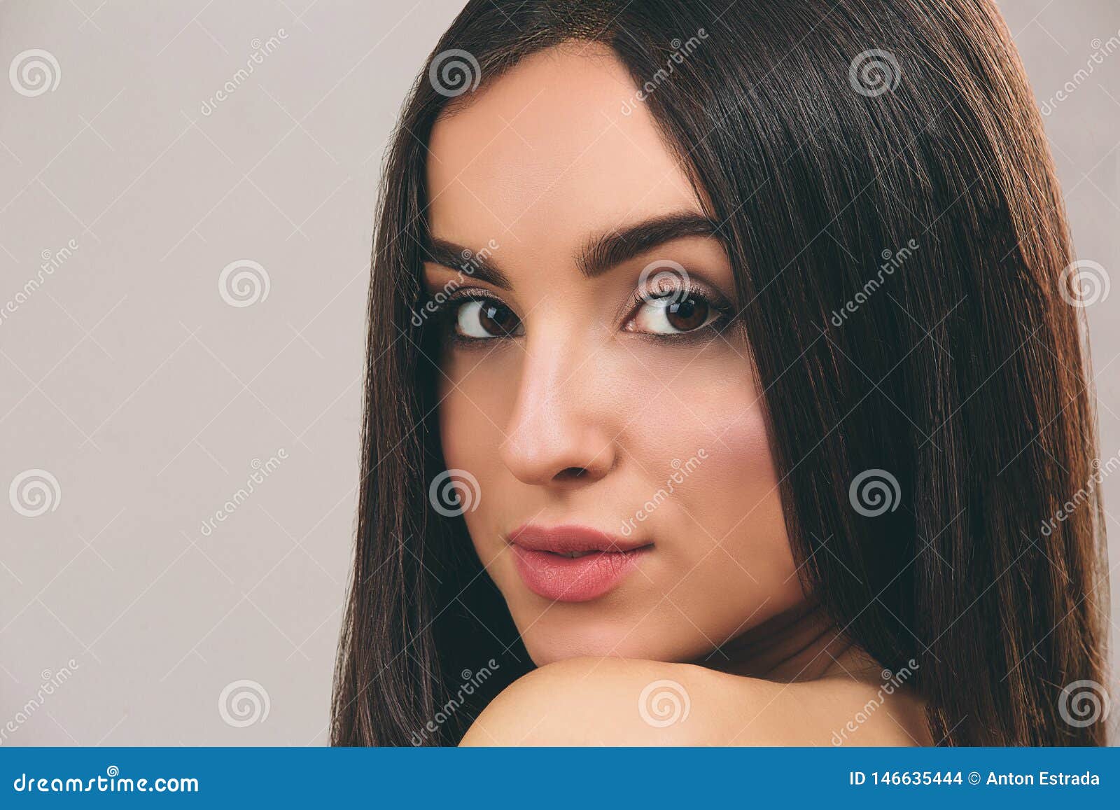 Young Woman with Long Black Hair Posing on Camera. Close Up Portrait of ...