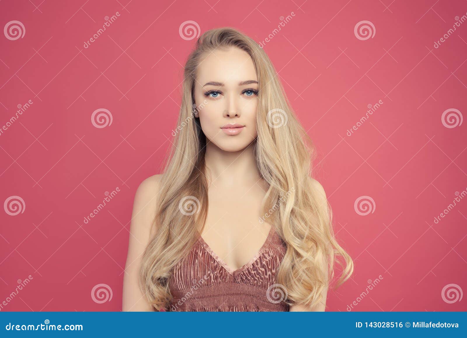 Young Woman With Long Blonde Hair And Natural Makeup Portrait
