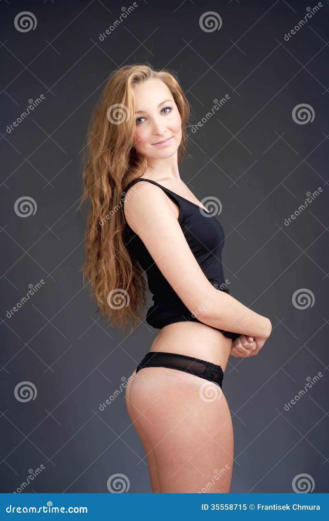 Beautiful female with brown hair. Woman in underwear with slim