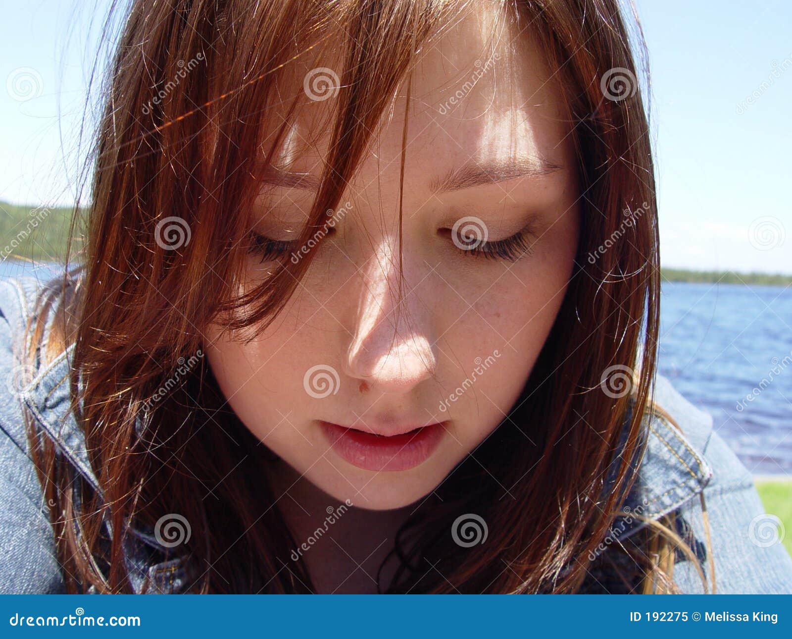 Young Woman Looking Down stock image. Image of feminine - 192275