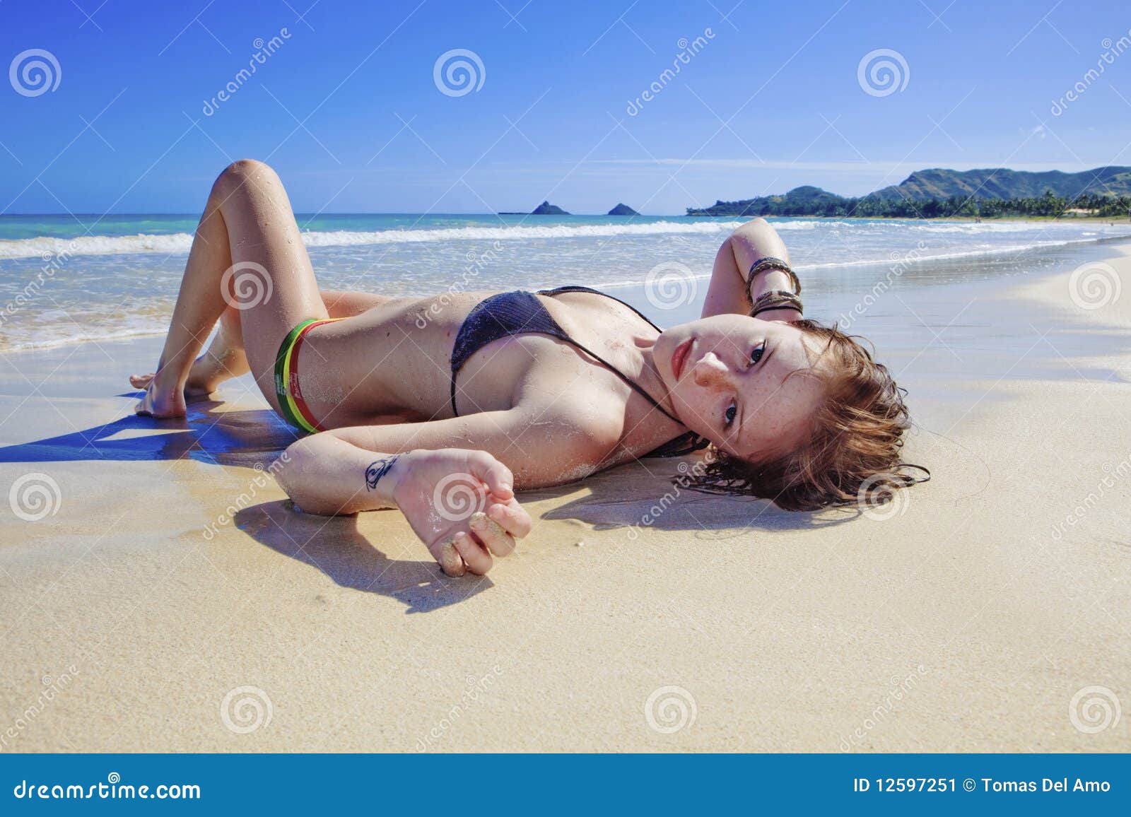 https://thumbs.dreamstime.com/z/young-woman-lounging-beach-12597251.jpg