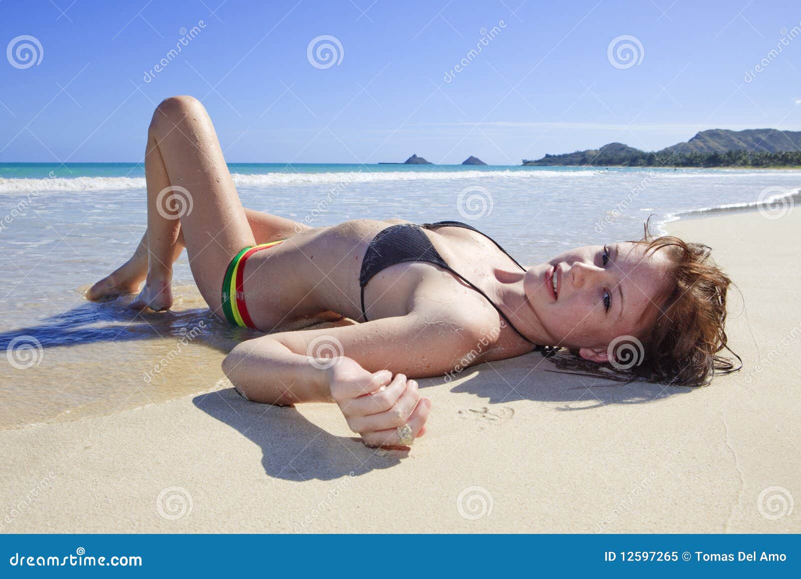 https://thumbs.dreamstime.com/z/young-woman-lounging-beach-12597265.jpg