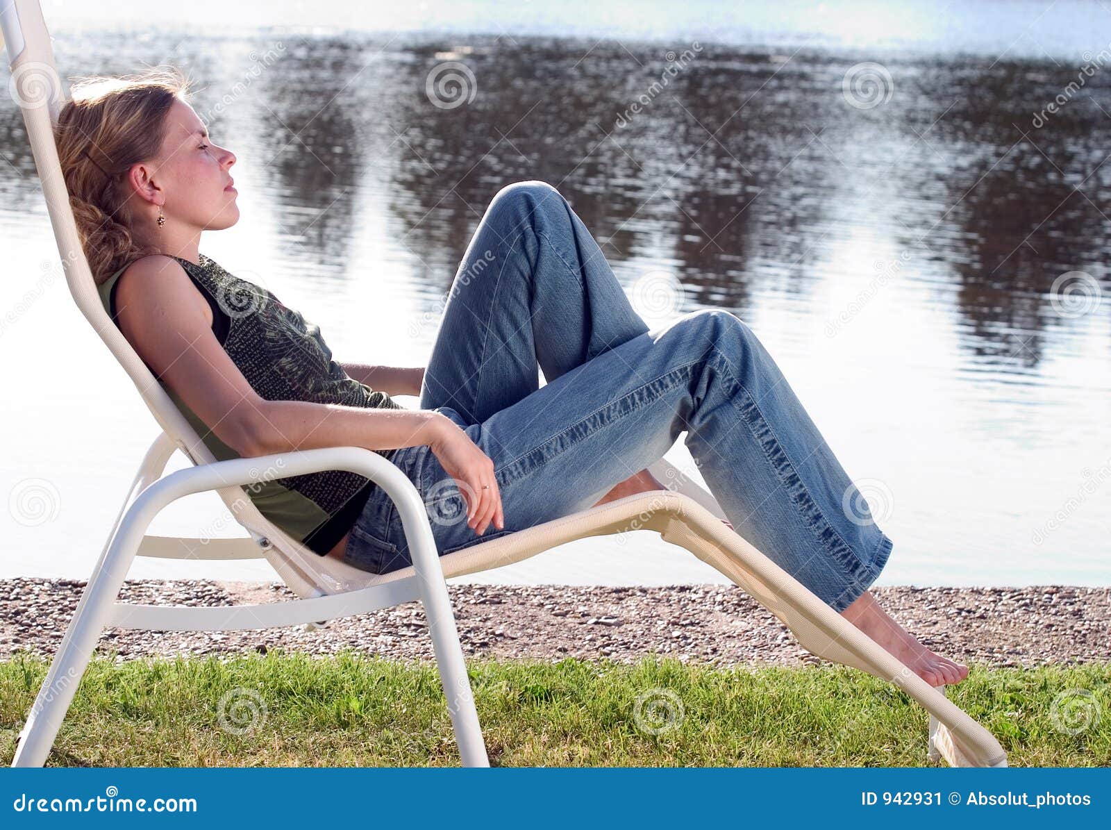 Young Woman Lounging In A Deck Chair Stock Image - Image: 942931