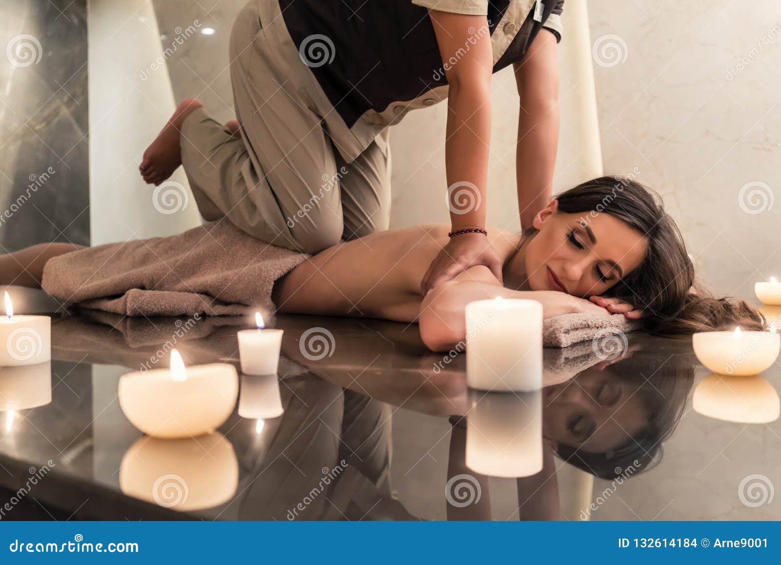 young woman enjoying the acupressure techniques of thai massage