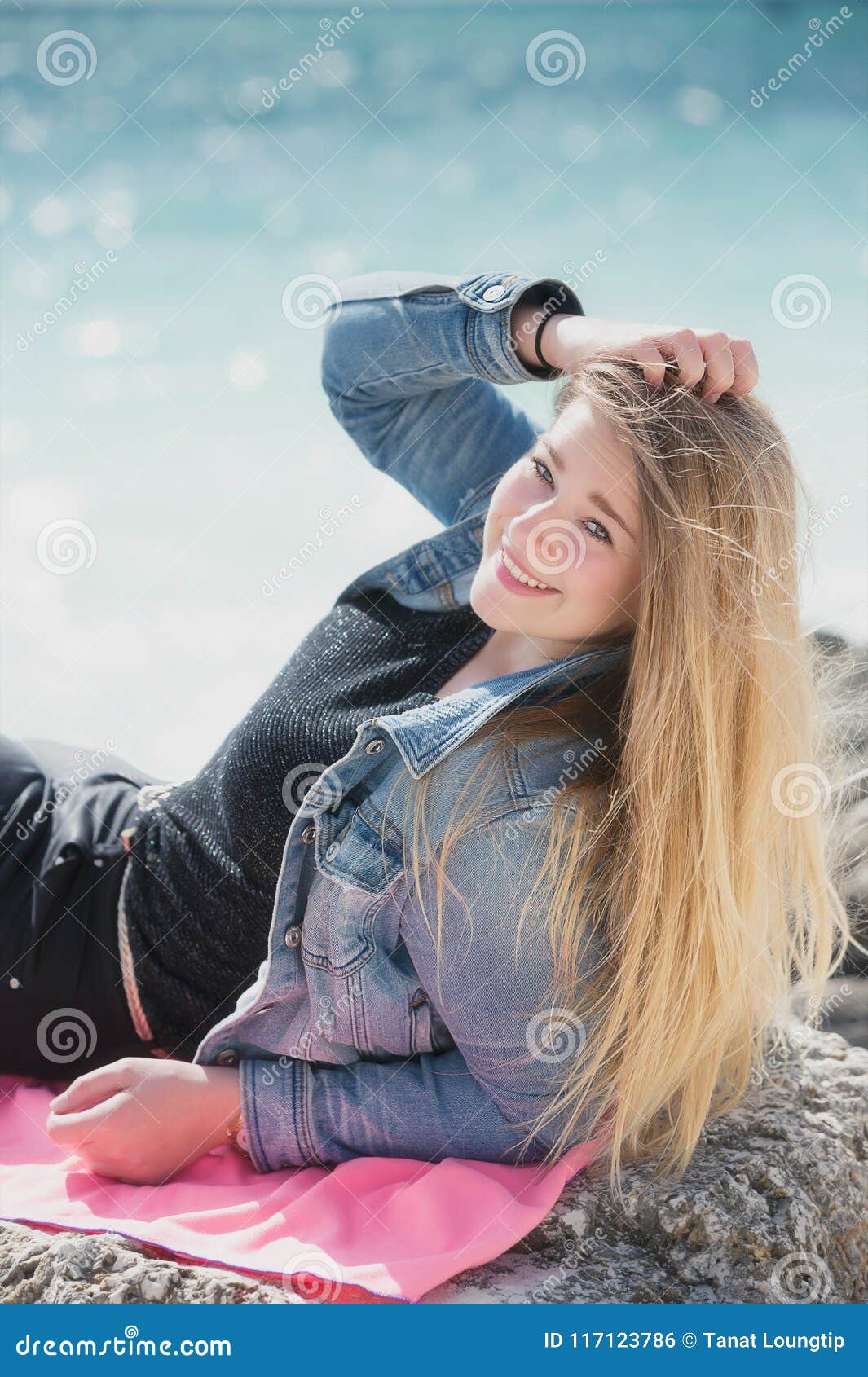 Young Woman Lying Down On The Stone At Beach Bahamas Stock 
