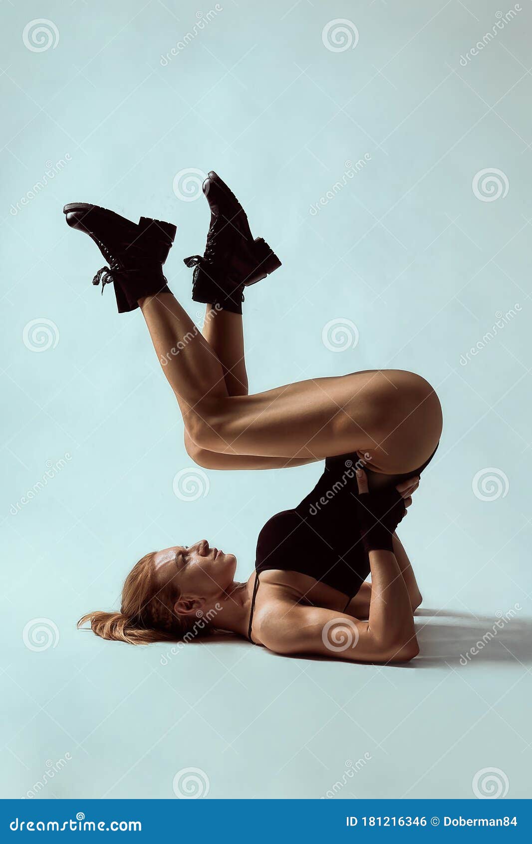 A Young Woman Lying on the Floor in the Studio Showing Her Big Long Legs  and Bottom, on a White Background. Copy Space Stock Photo - Image of legs,  fitness: 181216346