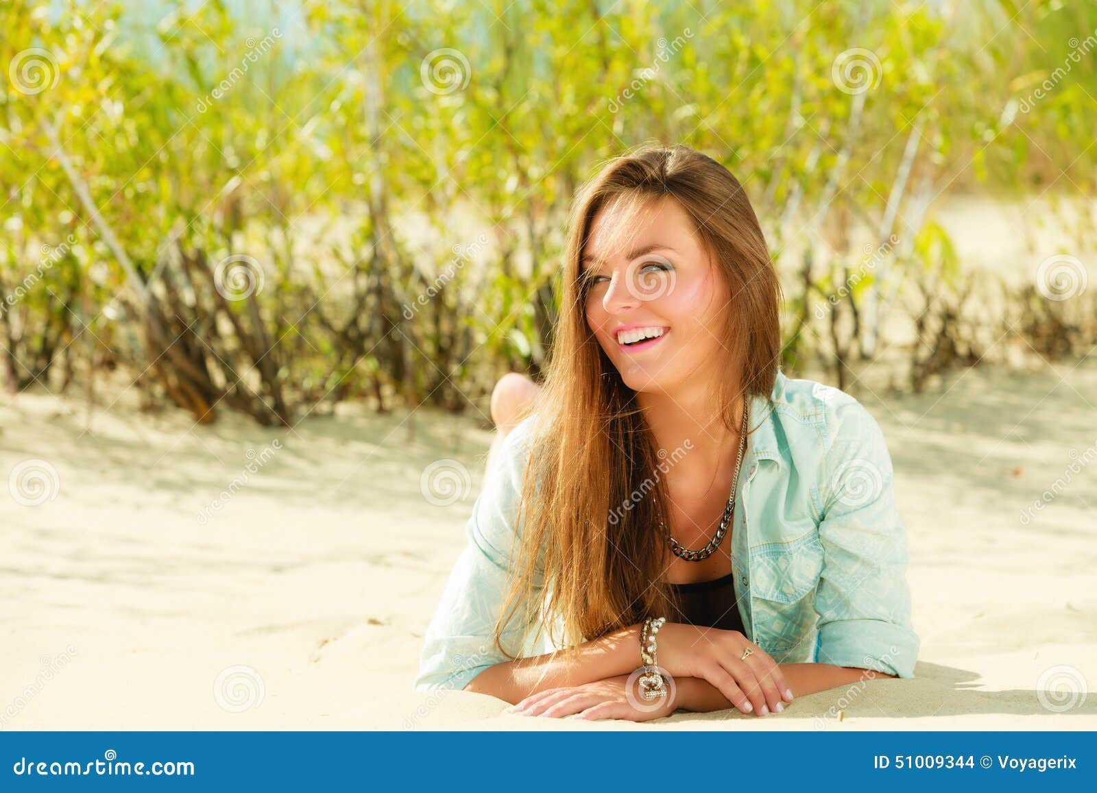 Young Woman Lying on Grassy Dune Stock Photo - Image of beachwear, girl ...
