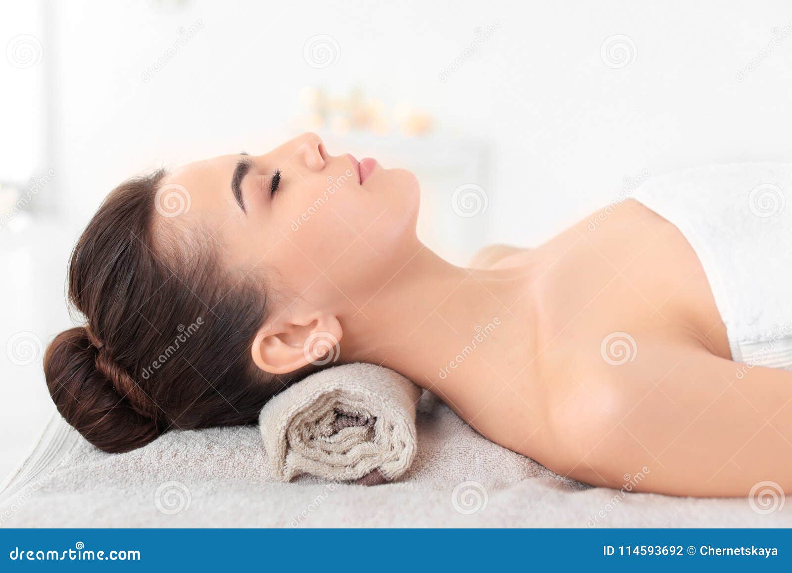 Beautiful Woman Lying On Massage Table At Spa Center Stock 