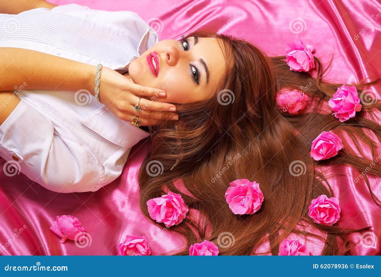 Beautiful Girl Lying On The Floor And Smiling, With Tulip 