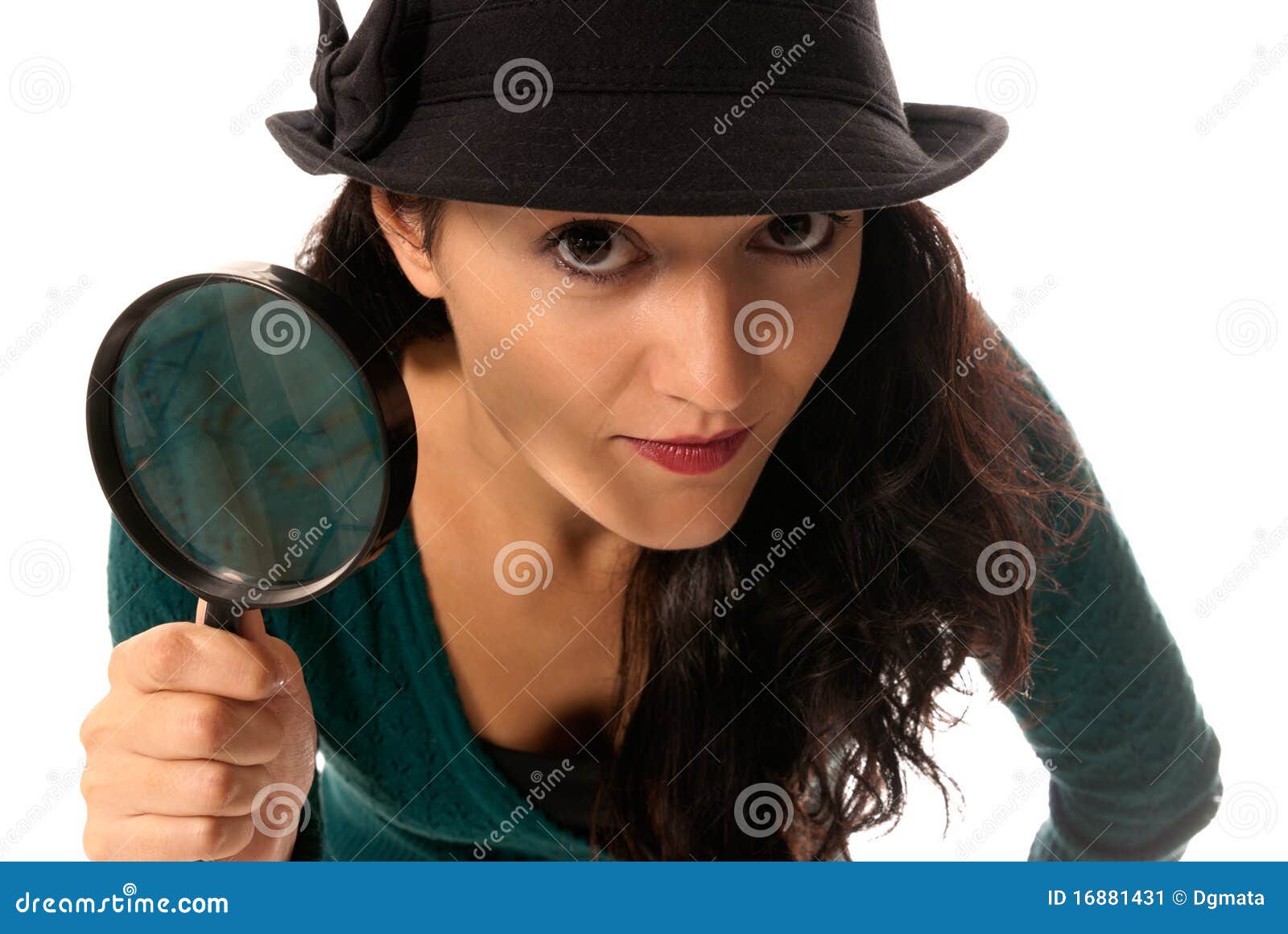 young woman with magnifier glass and hat looking