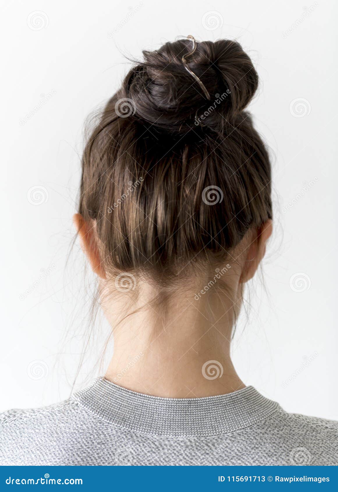 Young Woman Making Hair Bun Stock Image - Image of casual, hairstyle: 115691713 Young Woman Making Hair Bun Stock Image - Image of casual, hairstyle: 115691713