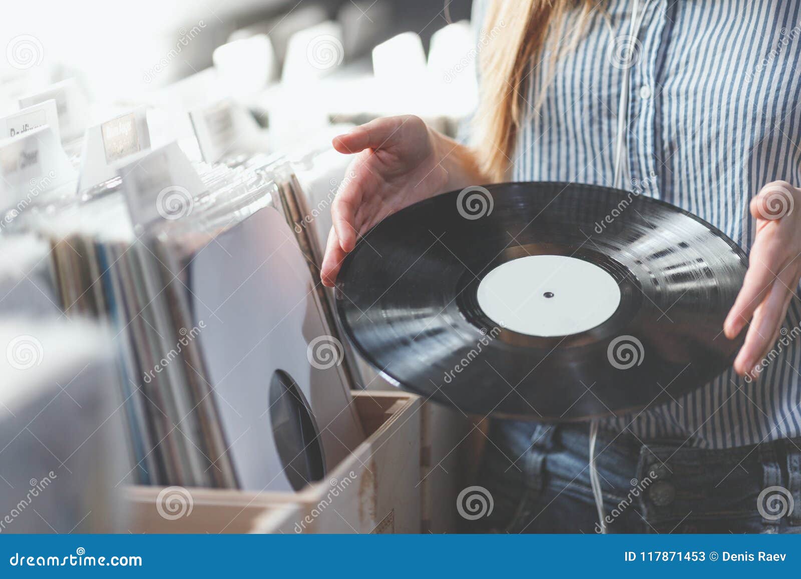 young woman with music records indoors