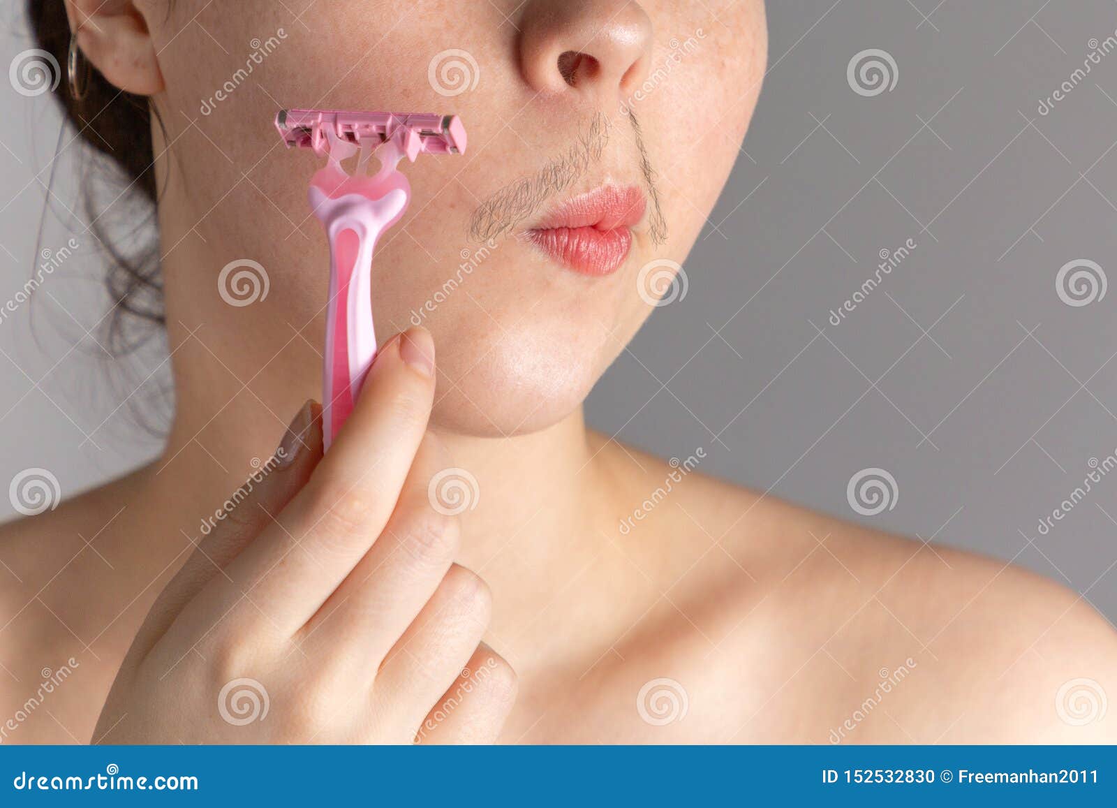 A Young Woman with a Mustache Holds a Razor To Her Cheek. the Concept of  Getting Rid of Unwanted Facial Hair Stock Photo - Image of concept,  lifestyle: 152532830