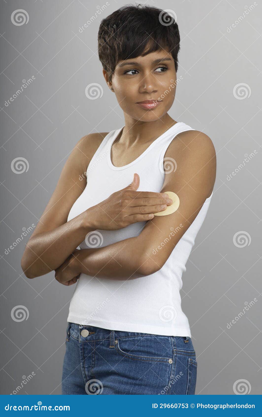 young woman with nicotine patch on arm