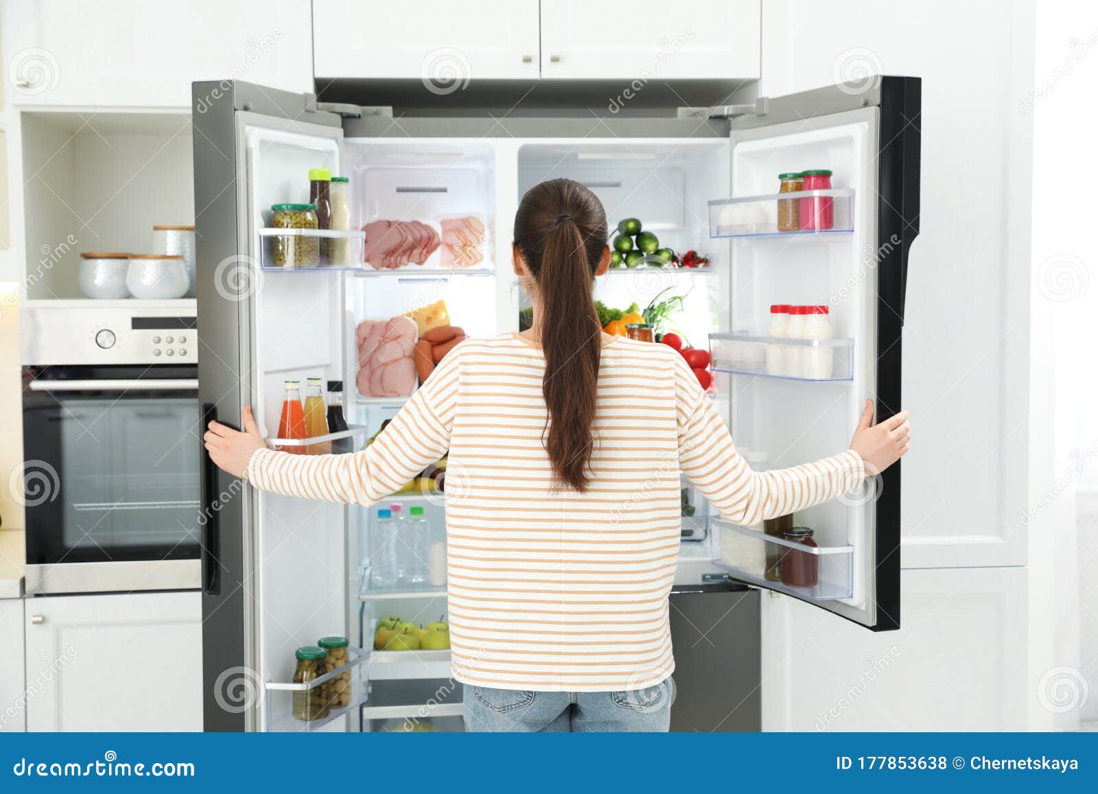 Young Woman Opening Refrigerator in Kitchen Stock Photo Image of