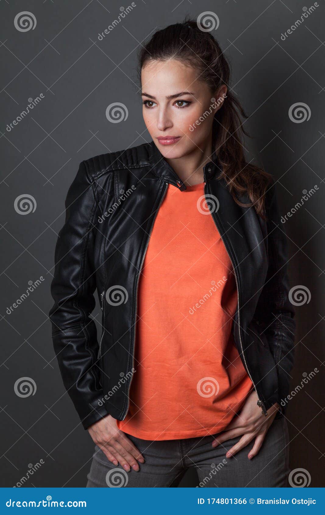 Download Young Woman In Orange T Shirt And Black Leather Jacket Studio Shot T Shirt Mock Up Stock Photo Image Of Beautiful Tshirt 174801366