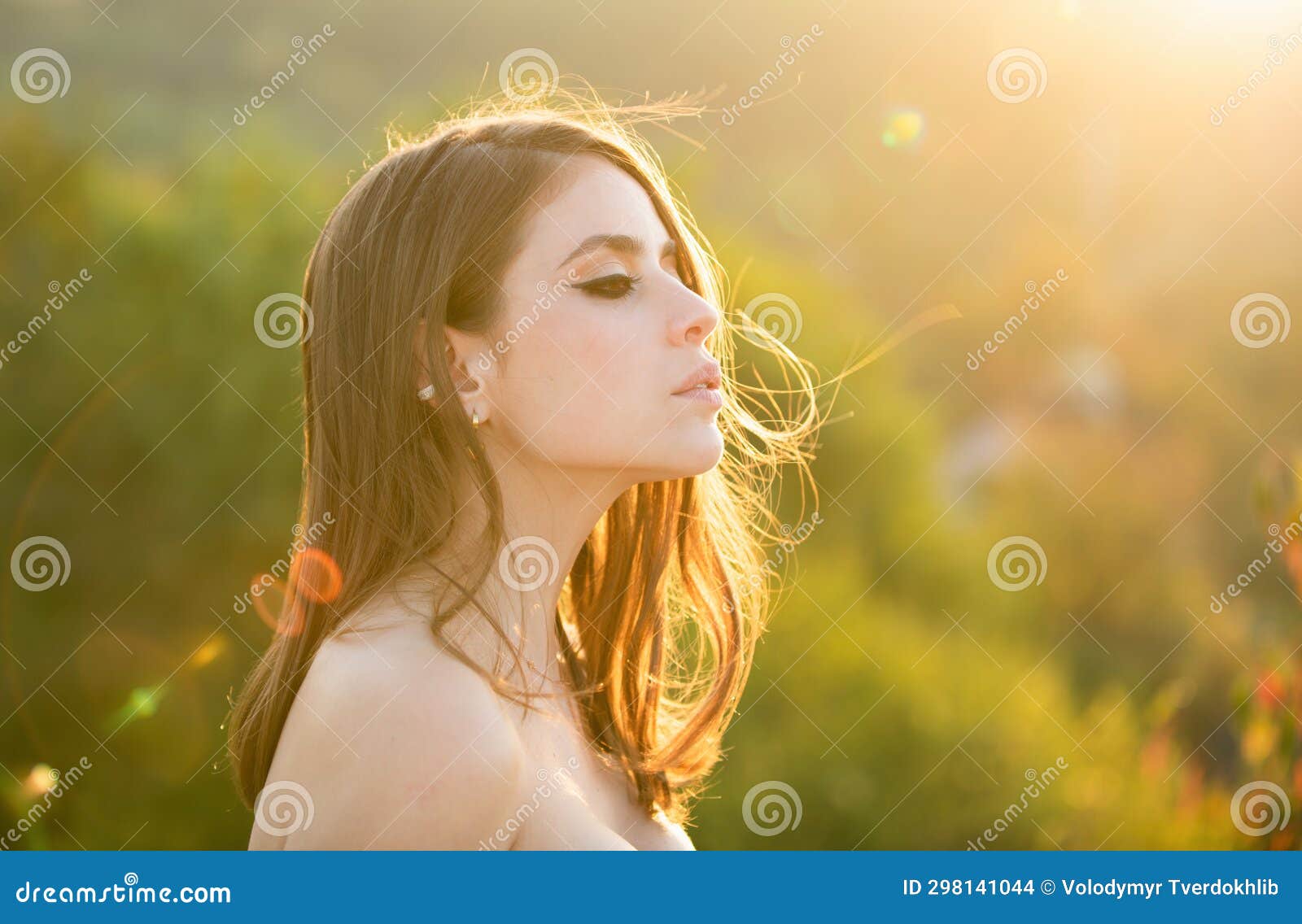 young woman outdoor enjoying the sunlight. spring romantic casual woman portrait. beautiful girl looking eways in summer