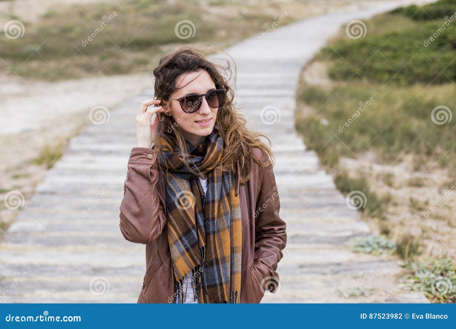 young woman outdoors portrait on a windy day