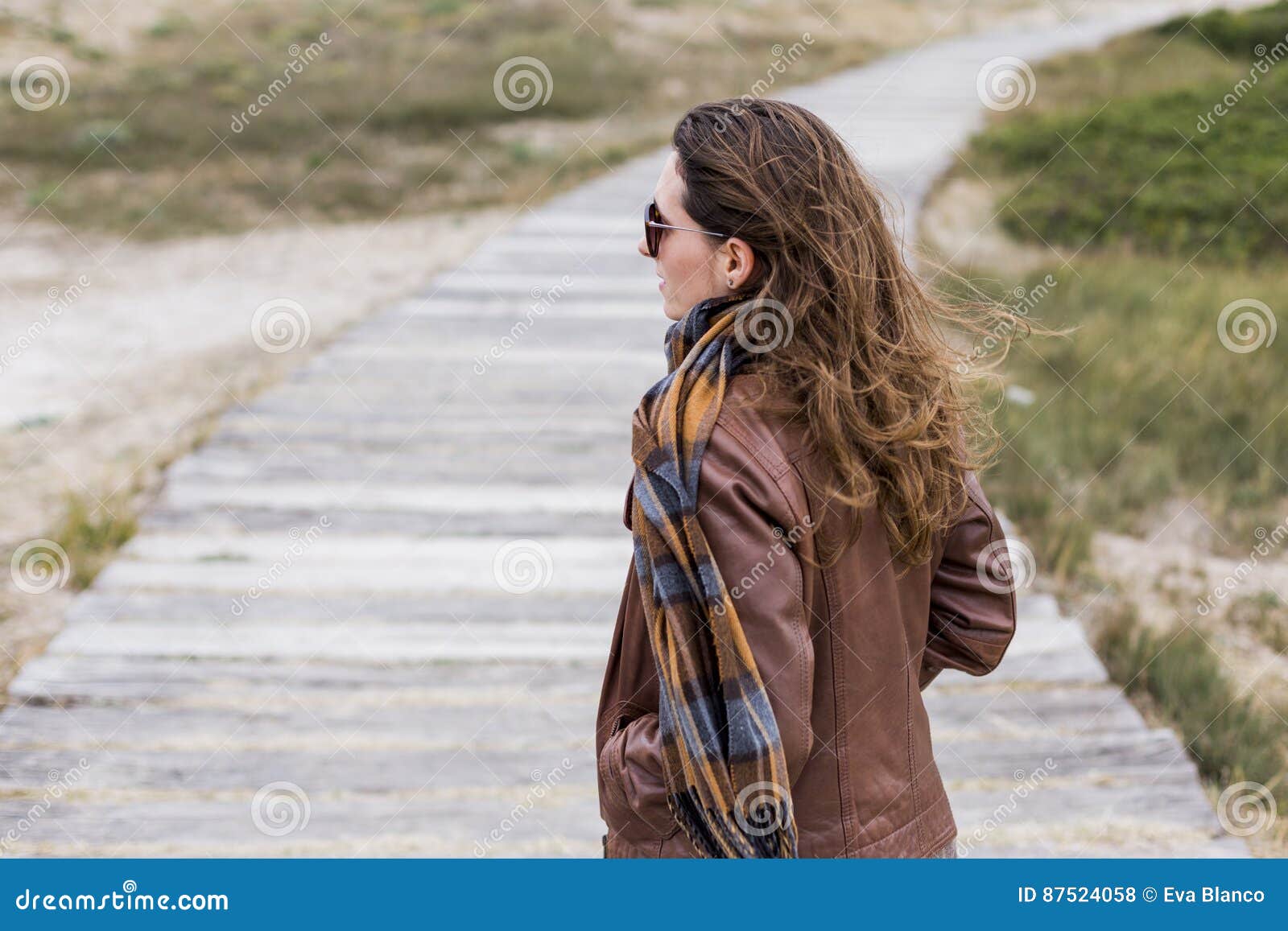 young woman outdoors portrait on a windy day