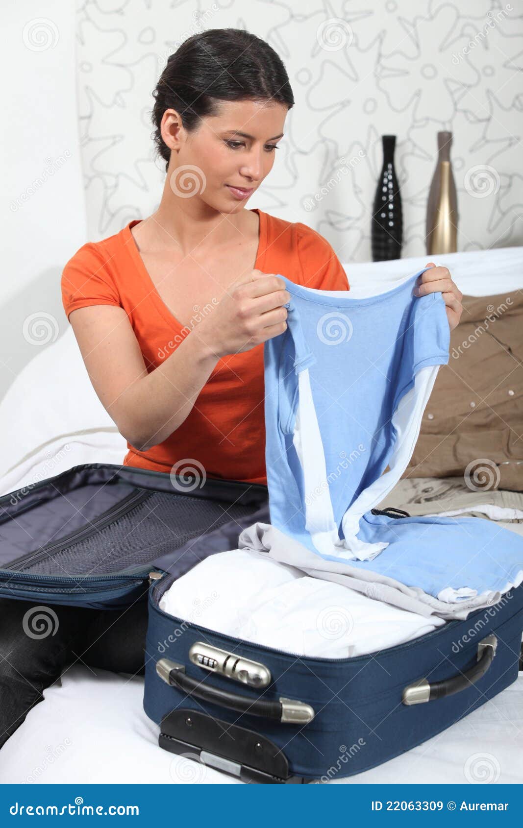 Young Woman Packing Clothes into Travel Bag Stock Image - Image of