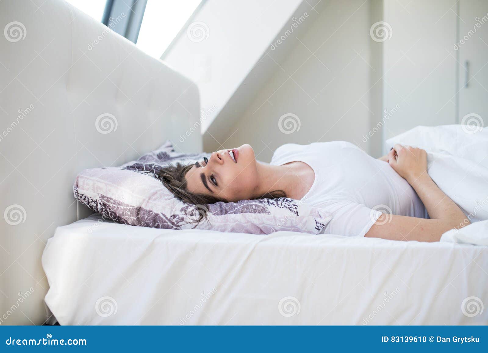 Young woman in pain lying stock photo. Image of pain 83139610