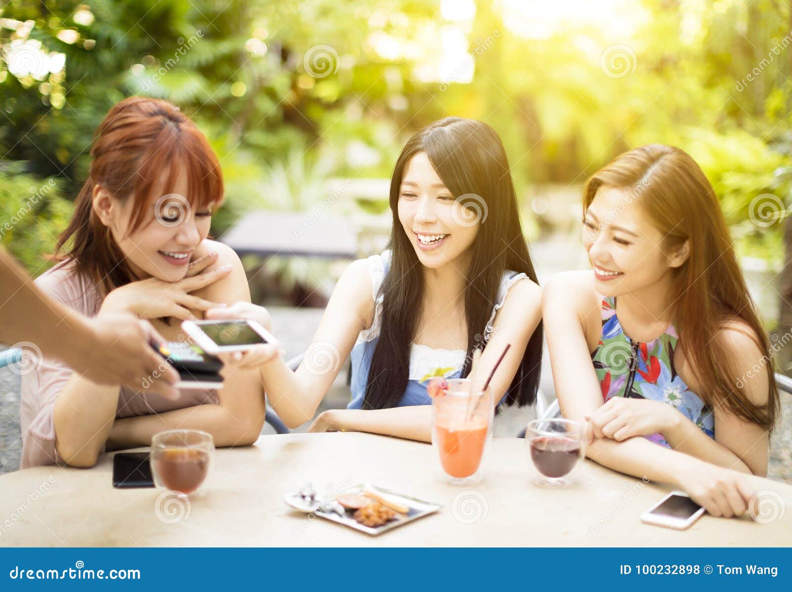 young woman paying bill with smart phone