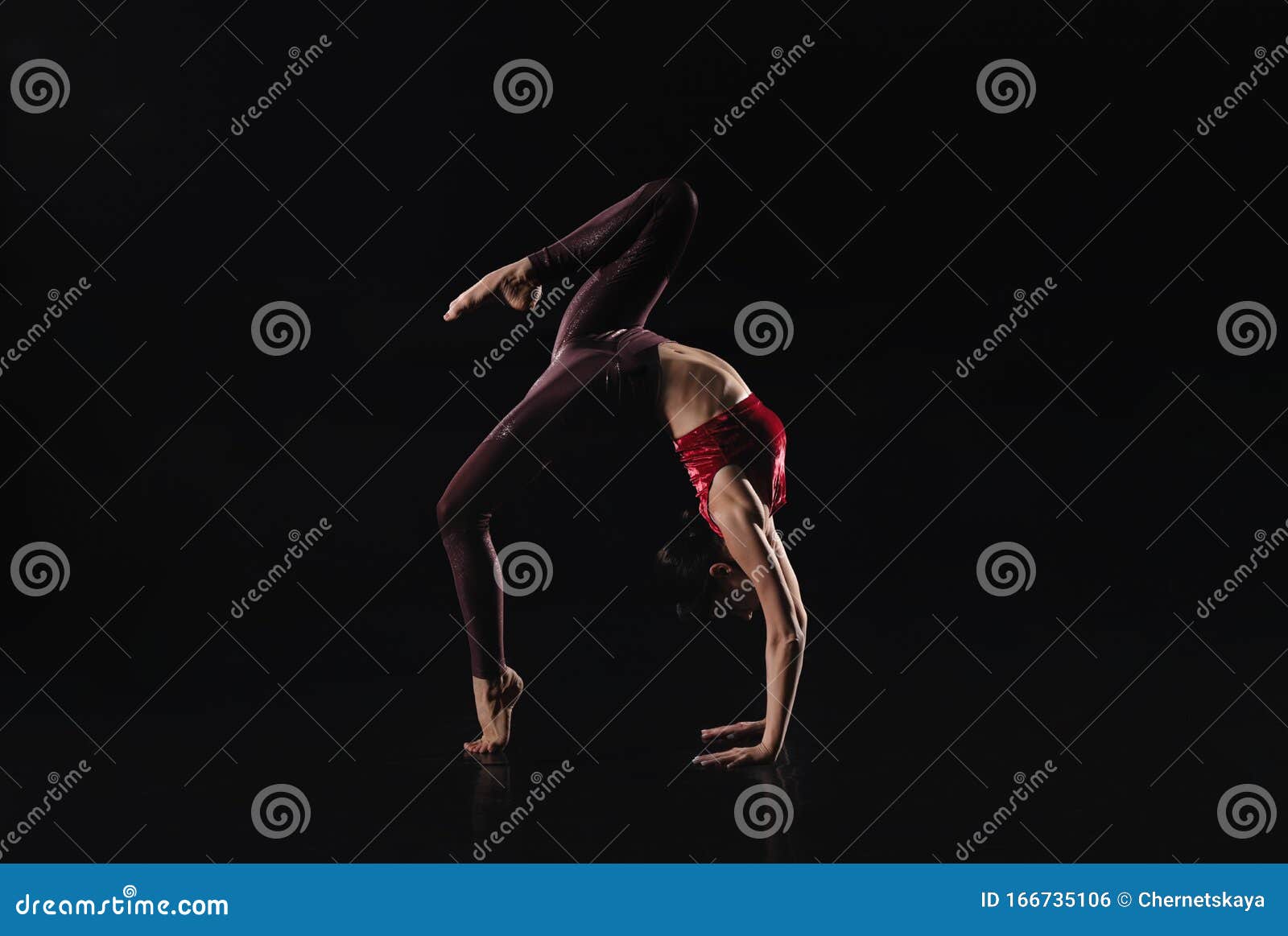 Young Woman Performing Acrobatic Element on Stage. Space for Text Stock ...