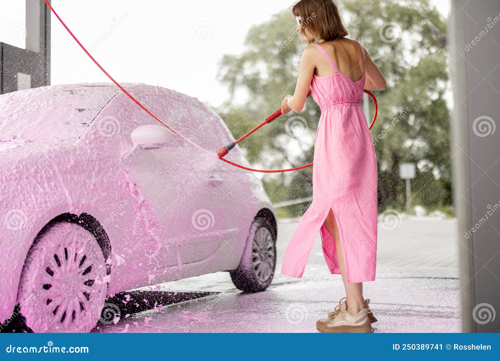 Woman in Pink Dress Washing Her Tiny Car with Nano Foam at Car