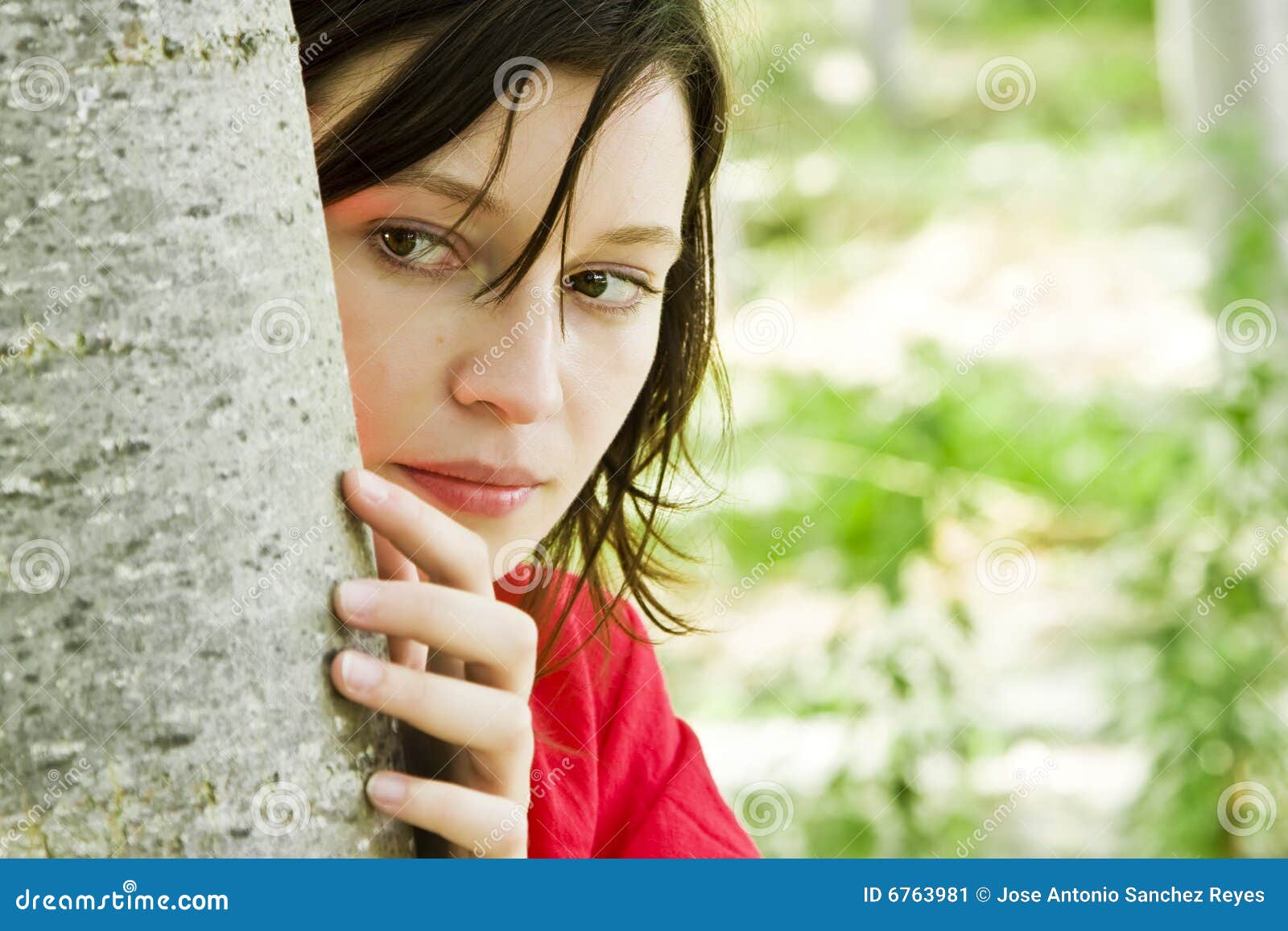 young woman playing hide and seek
