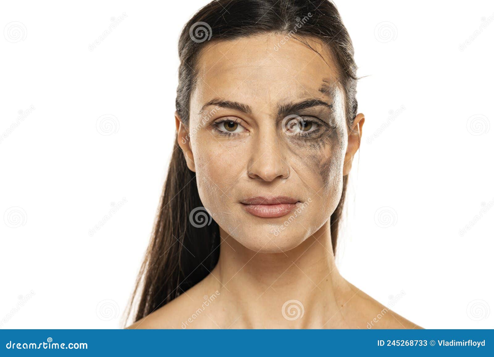 a young woman posing with half face dirty and half cleansed of makeup