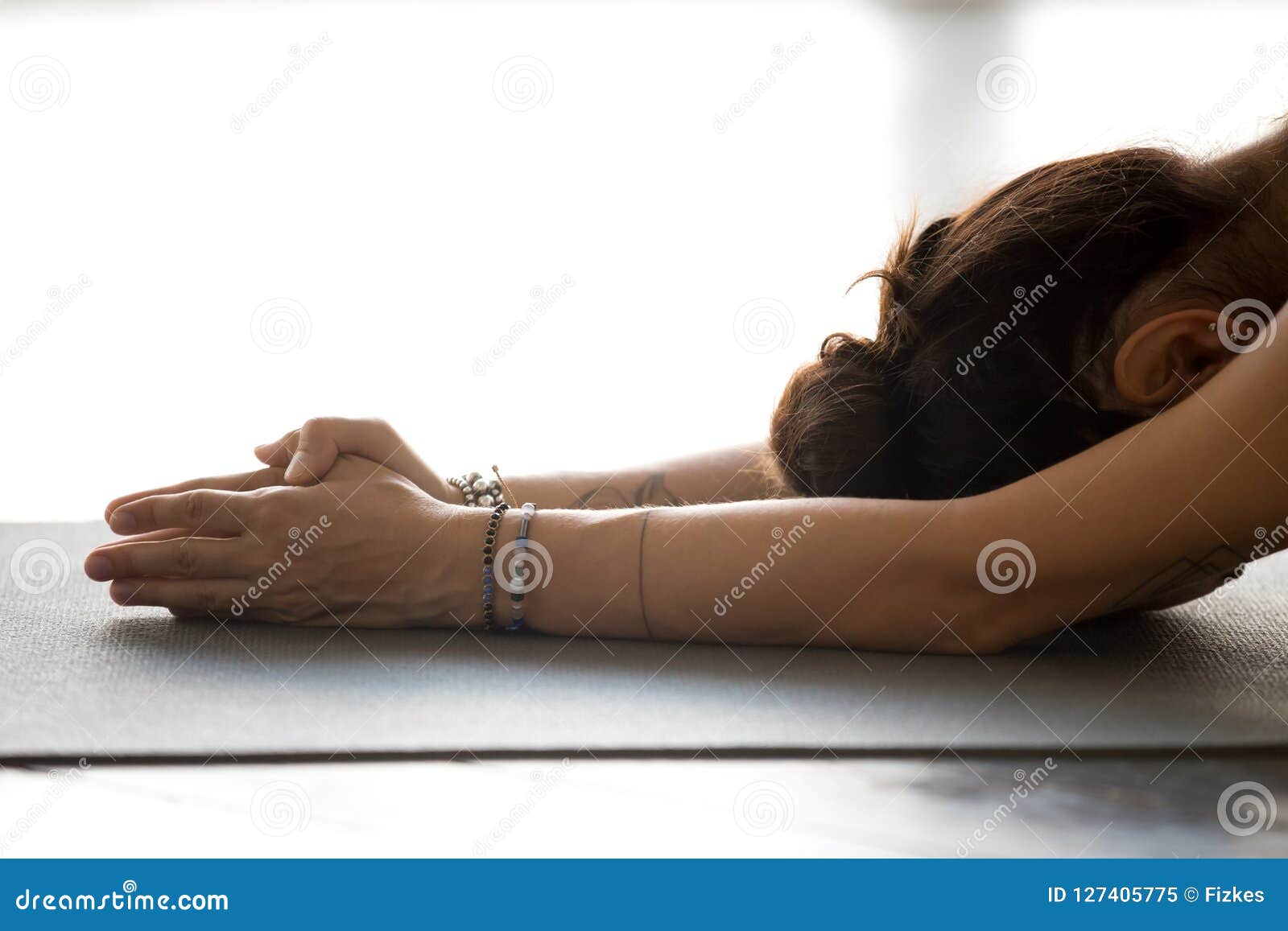 young woman practicing yoga, doing meditation exercise