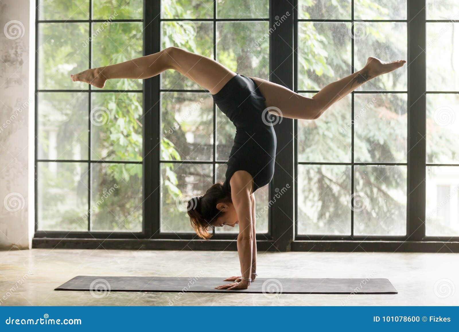 Young Attractive Woman in Adho Mukha Vrksasana Pose, Window Back Stock  Photo - Image of gymnastics, inversion: 101078600